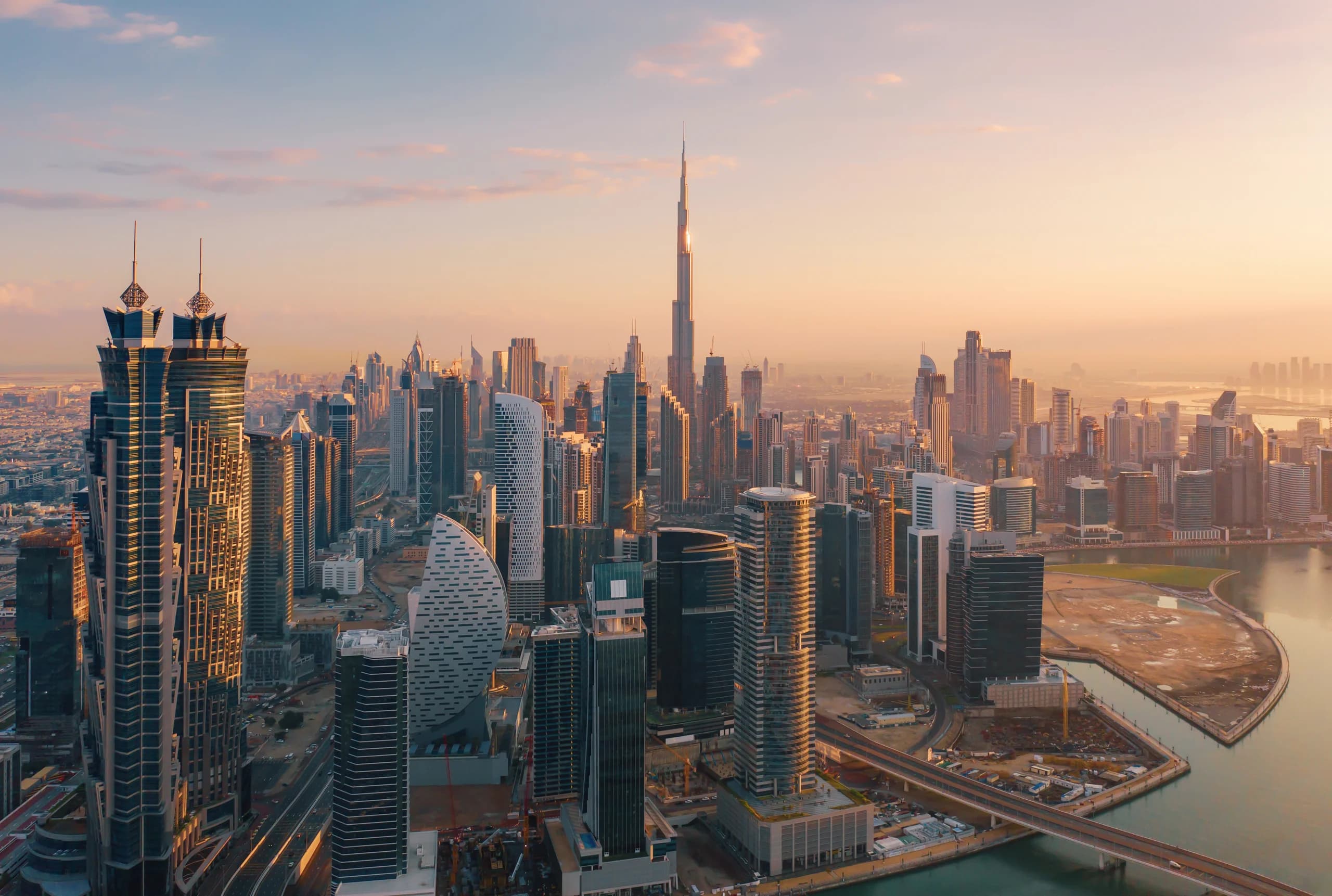 Towers under construction along the Dubai Canal in Business Bay