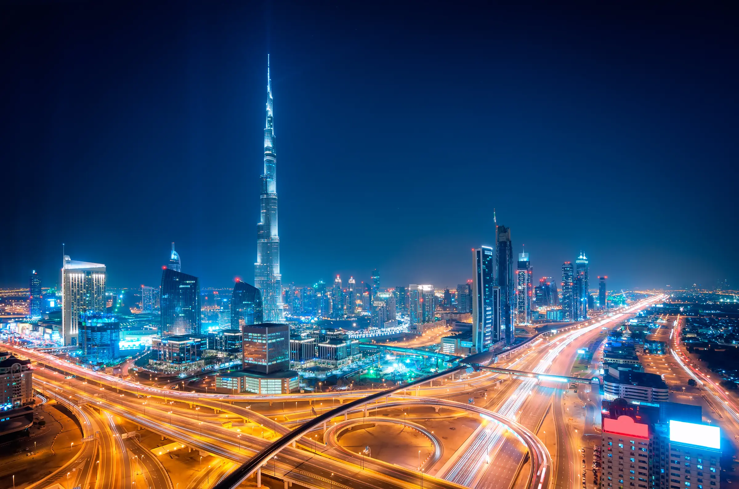 Downtown Dubai at night, Burj Khalifa above the interchange light trails